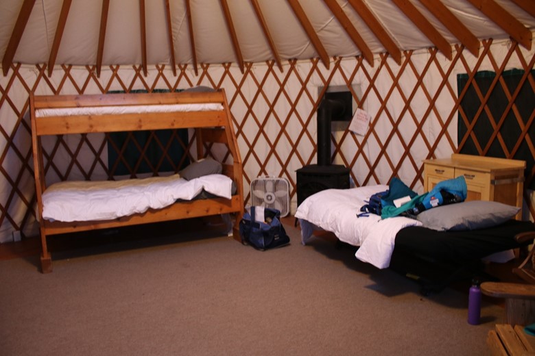 down pillows and spreads are a must for winter glamping