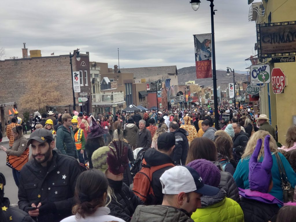 crowds of costumed trick-or-treaters pack Park City's Main Street on Halloween